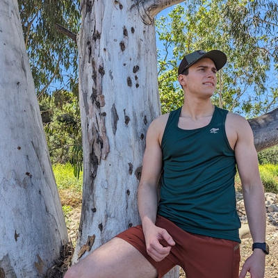 Runyon Mens Red Rock (Rust) TrailStash 7 Inch Gravel Short a performance short with zipper pockets that works great for Hiking