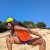 Runyon Women's Neon Orange Safety Fluorescent Orange Sleeveless Muscle Tee Performance Tank Top American Made In USA