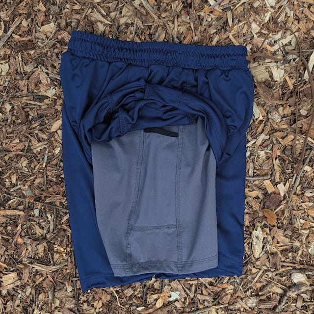Runyon SupraPlush™ navy blue 5-inch men's running shorts with 2-in-1 compression liner, lightweight performance shell, dual side pockets, phone pockets, handcrafted in Los Angeles, Made in USA.