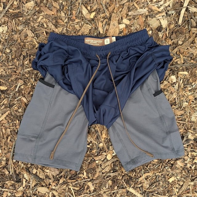 Runyon SupraPlush™ navy blue 5-inch men's running shorts with 2-in-1 compression liner, lightweight performance shell, dual side pockets, phone pockets, handcrafted in Los Angeles, Made in USA.