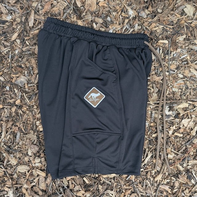 Runyon SupraPlush™ black 5-inch men's running shorts with 2-in-1 compression liner, lightweight performance shell, dual side pockets, phone pockets, handcrafted in Los Angeles, Made in USA.