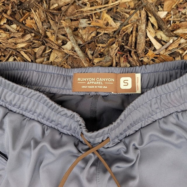 Runyon SupraPlush™ steel grey 5-inch men's running shorts with 2-in-1 compression liner, lightweight performance shell, dual side pockets, phone pockets, handcrafted in Los Angeles, Made in USA.