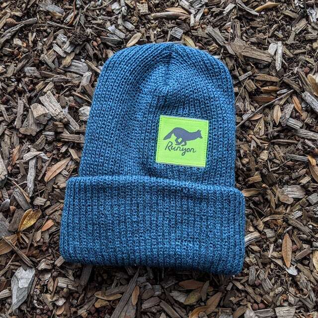 Runyon Aqua Neon Reflective Performance Knit Beanie 
a shade of teal pairs well with our neon fluorescent yellow reflective patch