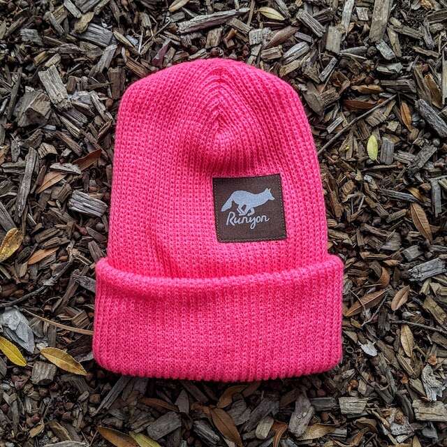 Runyon Hawt Fuchsia Reflective Performance Knit Beanie 
striking neon pink tones illuminate our dark brown reflective patch