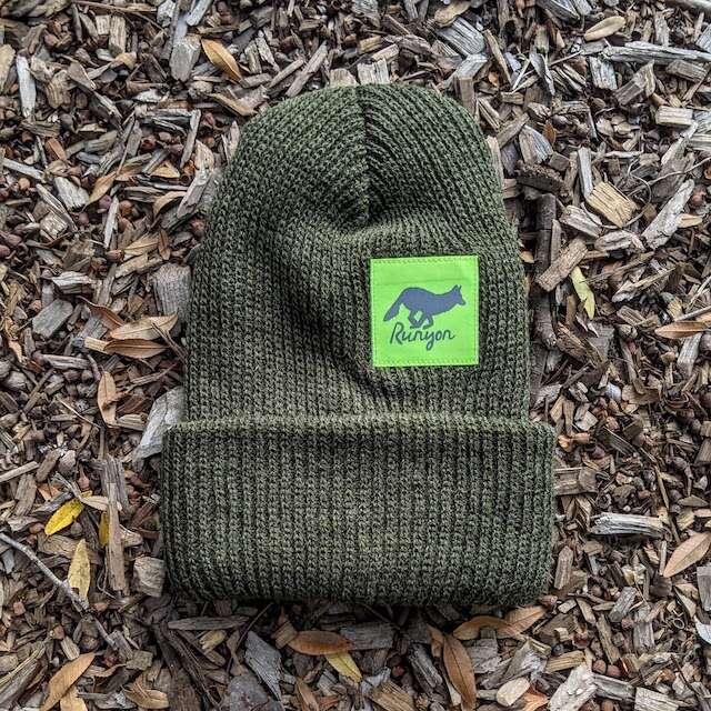 Runyon Pine Neon Reflective Performance Knit Beanie 
earthy olive green tones compliments our fluorescent neon yellow reflective patch